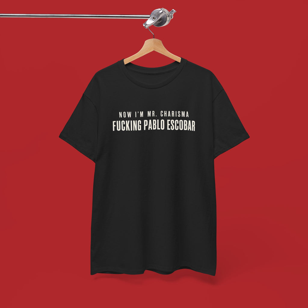 Black cotton T-shirt featuring bold white text "Now I'm Mr. Charisma Fucking Pablo Escobar" in graphic design style.