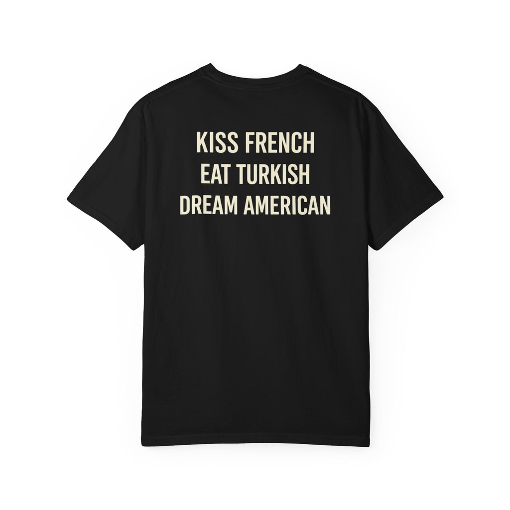 Unisex cotton T-shirt with "Kiss French, Eat Turkish, Dream American" slogan, featuring international couple design.