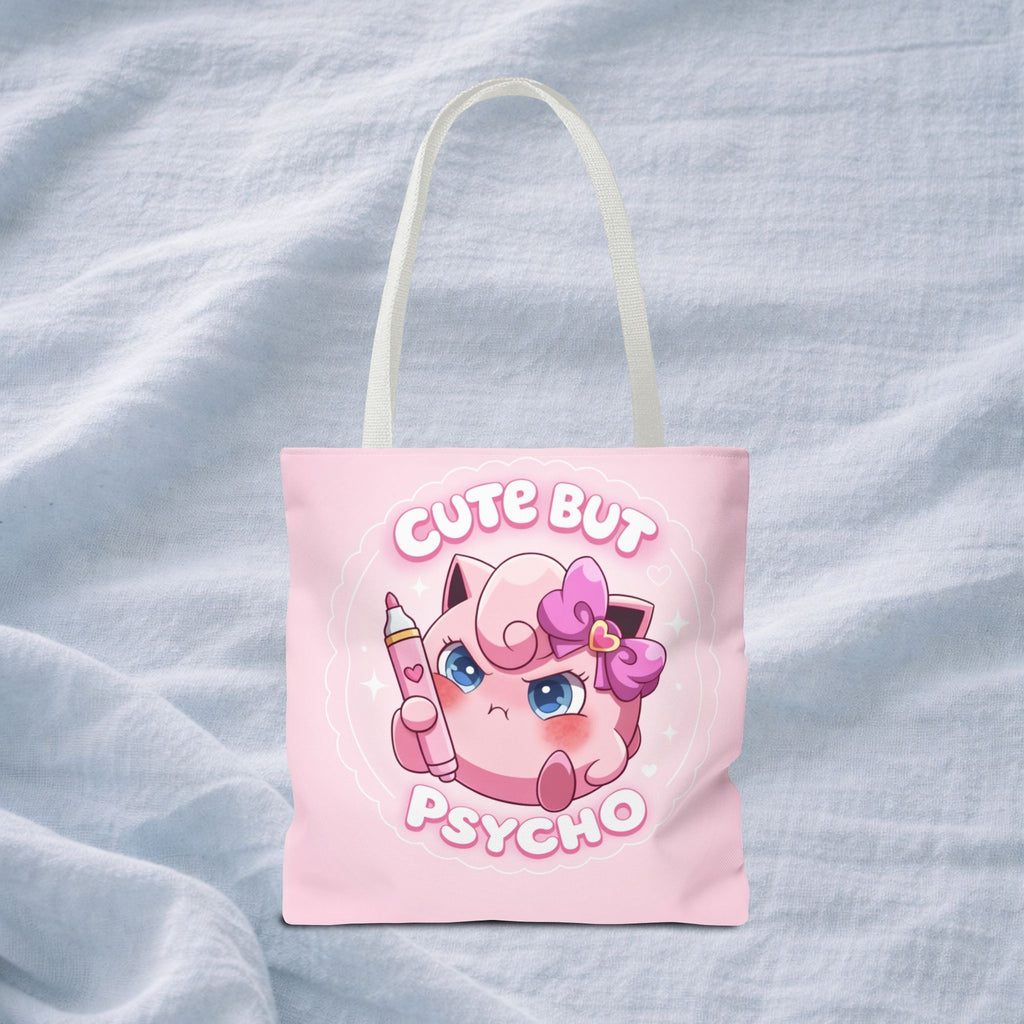 Pink "Cute But Psycho" tote bag by Printify featuring bold black text and a kawaii-inspired design on a spacious shopping bag.