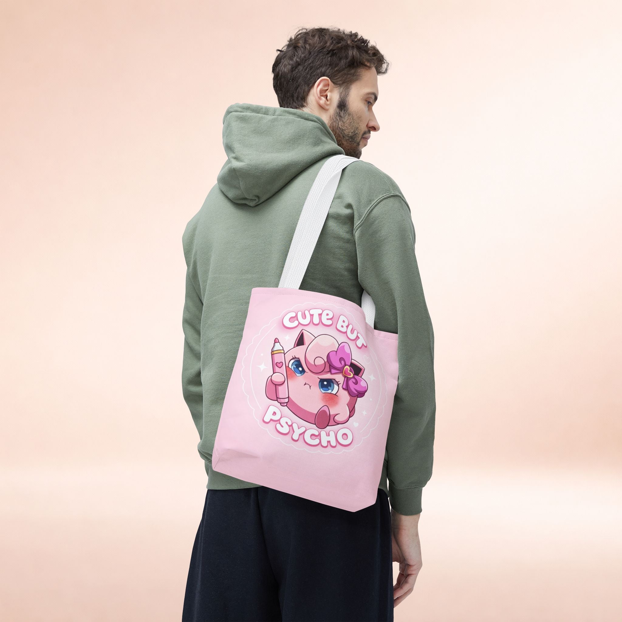 Pink "Cute But Psycho" tote bag by Printify featuring a kawaii style design, perfect for casual shopping and everyday use.