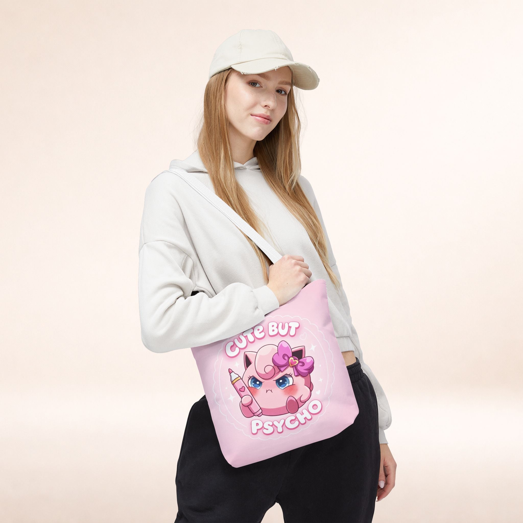 Pink "Cute But Psycho" tote bag by Printify, kawaii style shopper bag with bold text and playful design on fabric.