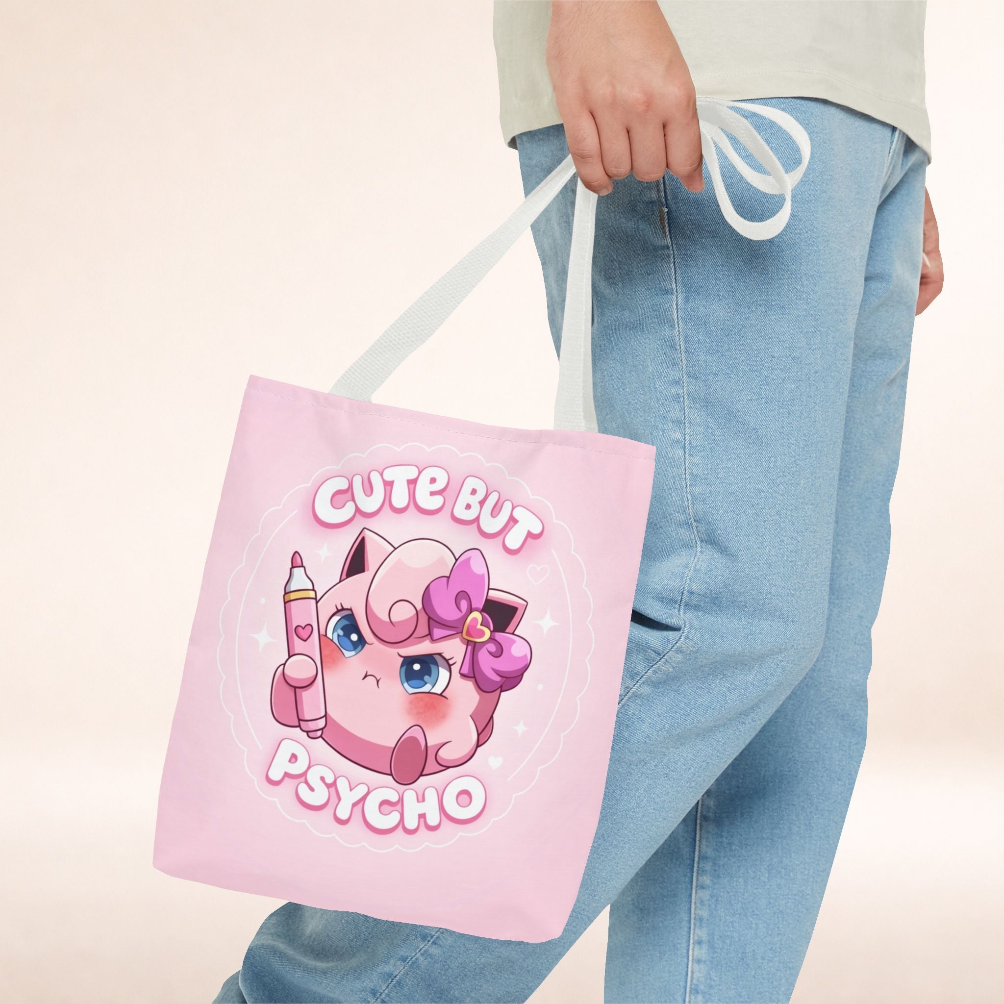 Pink "Cute But Psycho" tote bag with kawaii design, made by Printify, featuring bold text on a spacious shopper bag.