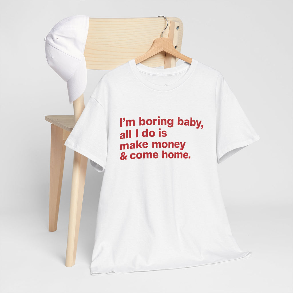 Unisex cotton T-shirt with humorous "I'm Boring Baby All I Do Is Make Money & Come Home" slogan, casual fit, Printify brand.