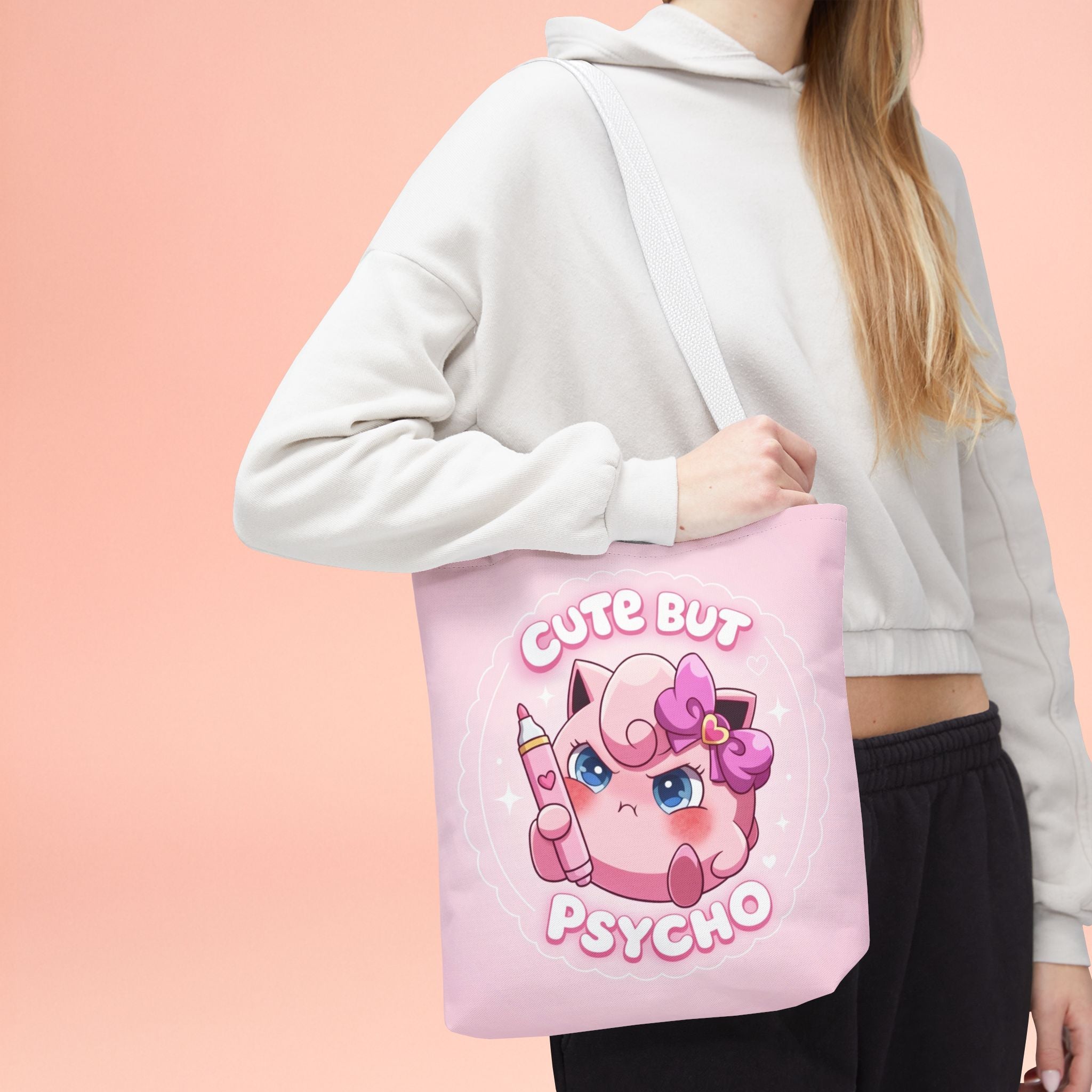 Pink "Cute But Psycho" tote bag featuring kawaii design, made by Printify, with a spacious fabric shopper style for everyday use.