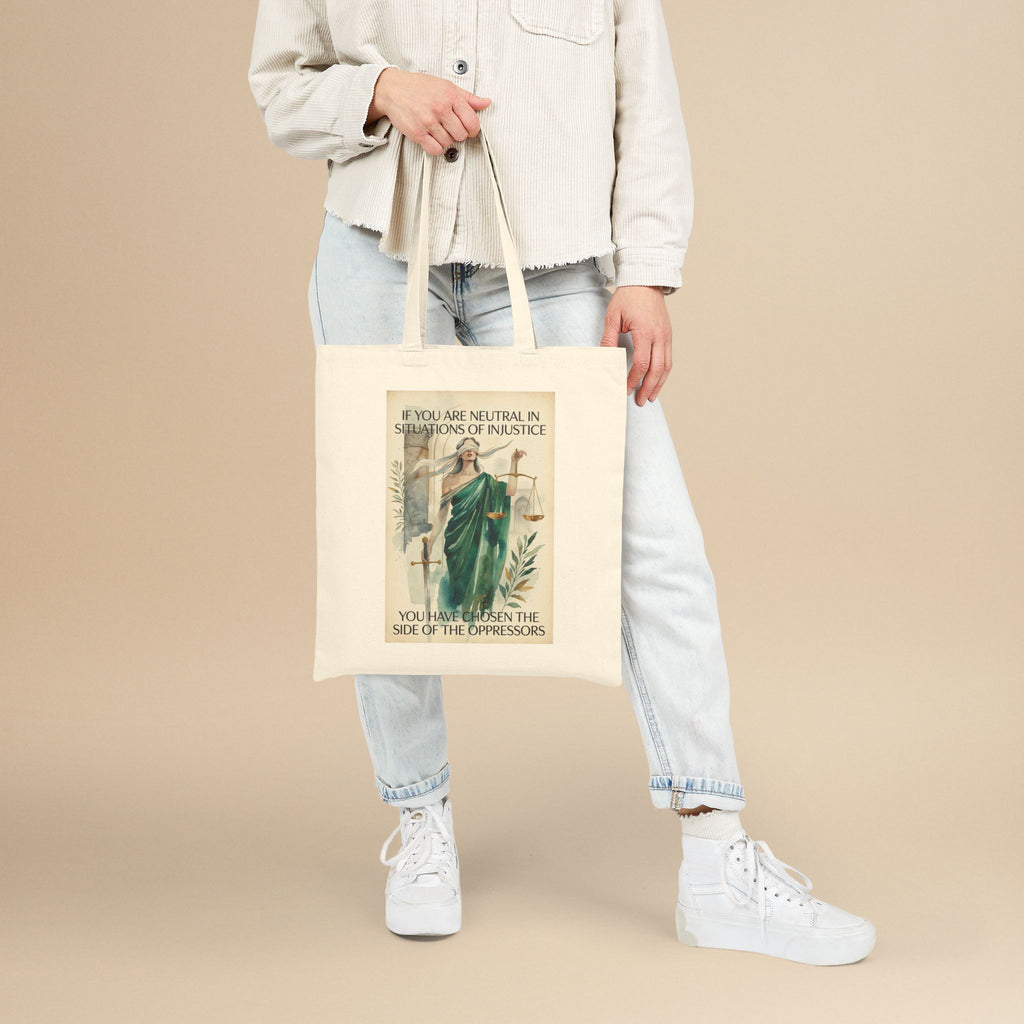 Social Justice tote bag featuring Lady Justice and the message "If you are neutral, you have chosen the oppressors," by Printify.