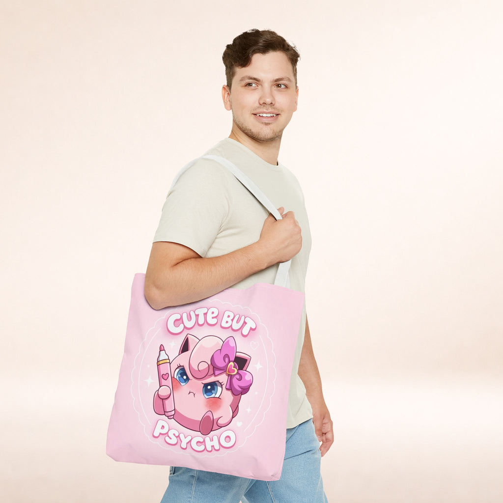 Pink "Cute But Psycho" tote bag by Printify, kawaii style shopper bag with bold black text and casual design.
