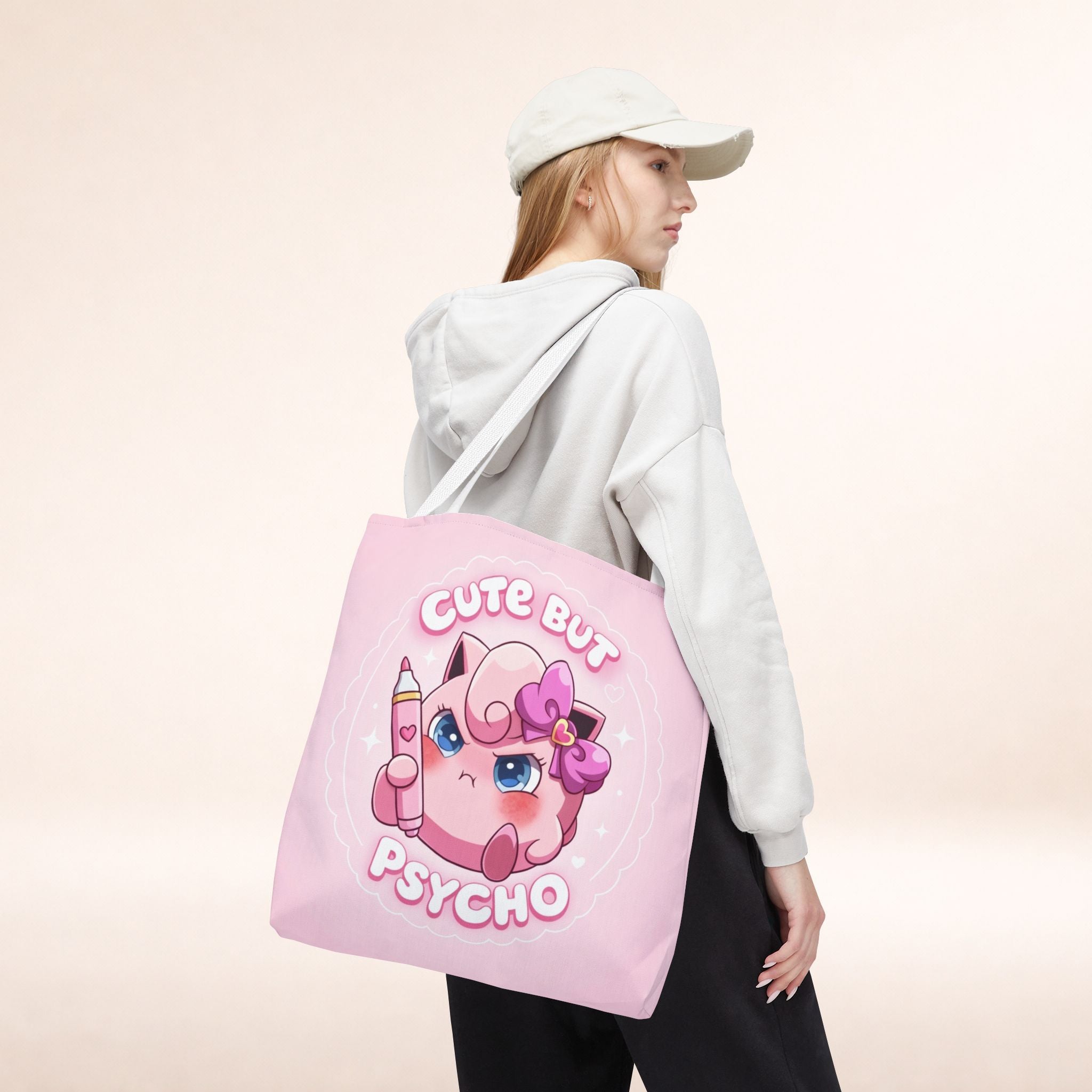 Pink "Cute But Psycho" tote bag by Printify featuring a kawaii design on a spacious shopper bag.