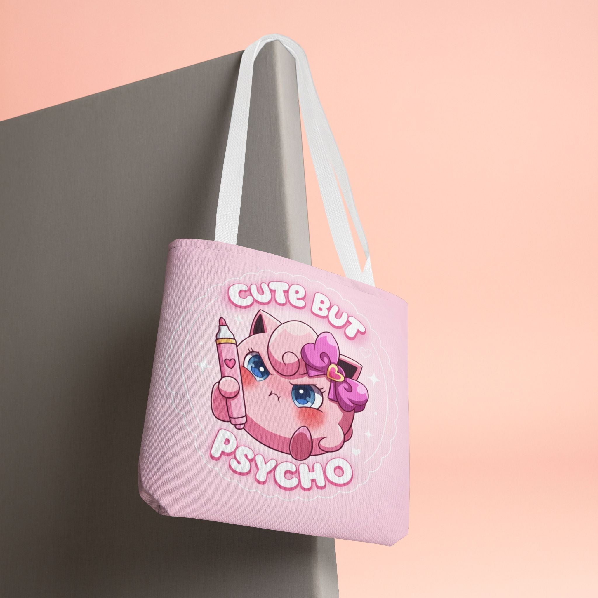 Pink "Cute But Psycho" tote bag by Printify, kawaii style shopper bag with bold black text and fun design on durable fabric.