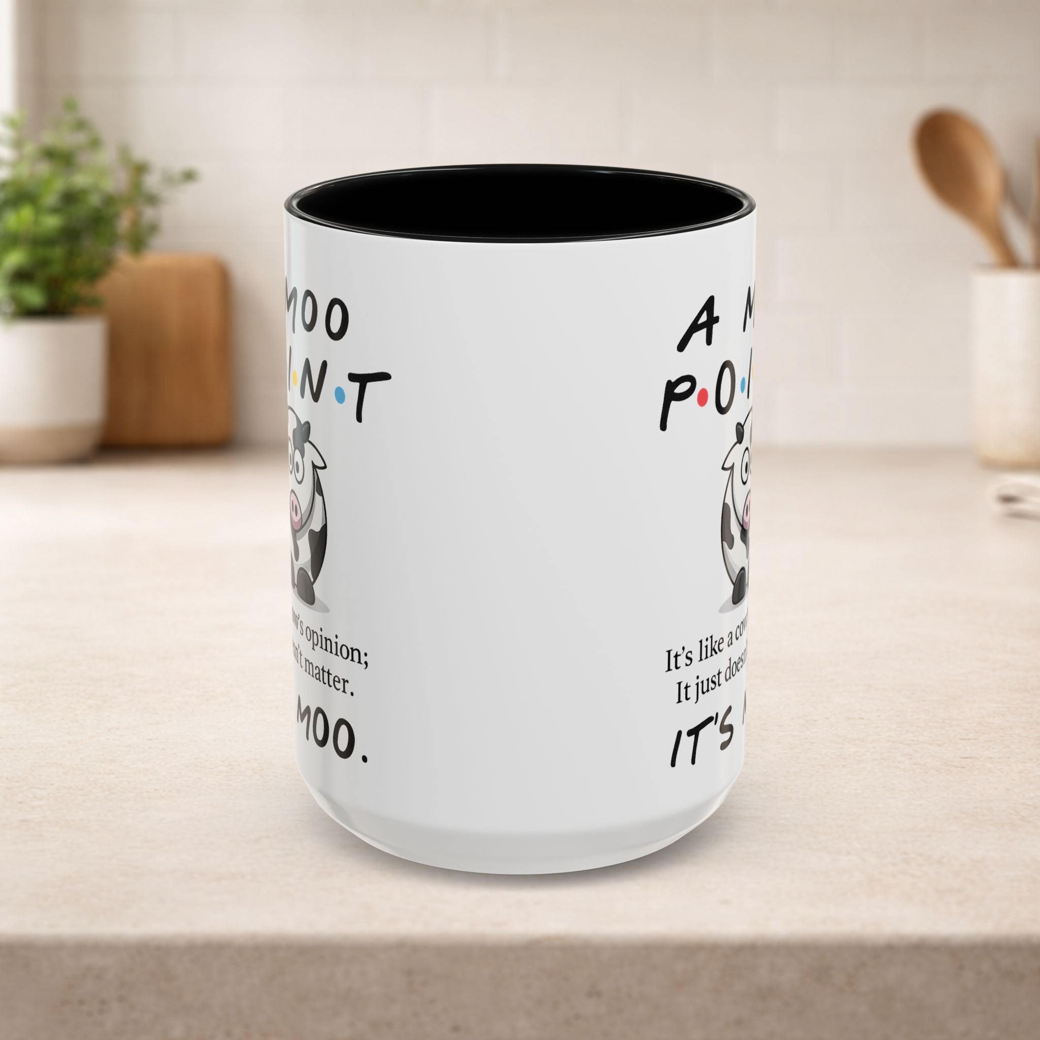Friends Moo Point mug featuring a cow design and humorous quote, ideal for coffee or tea lovers.