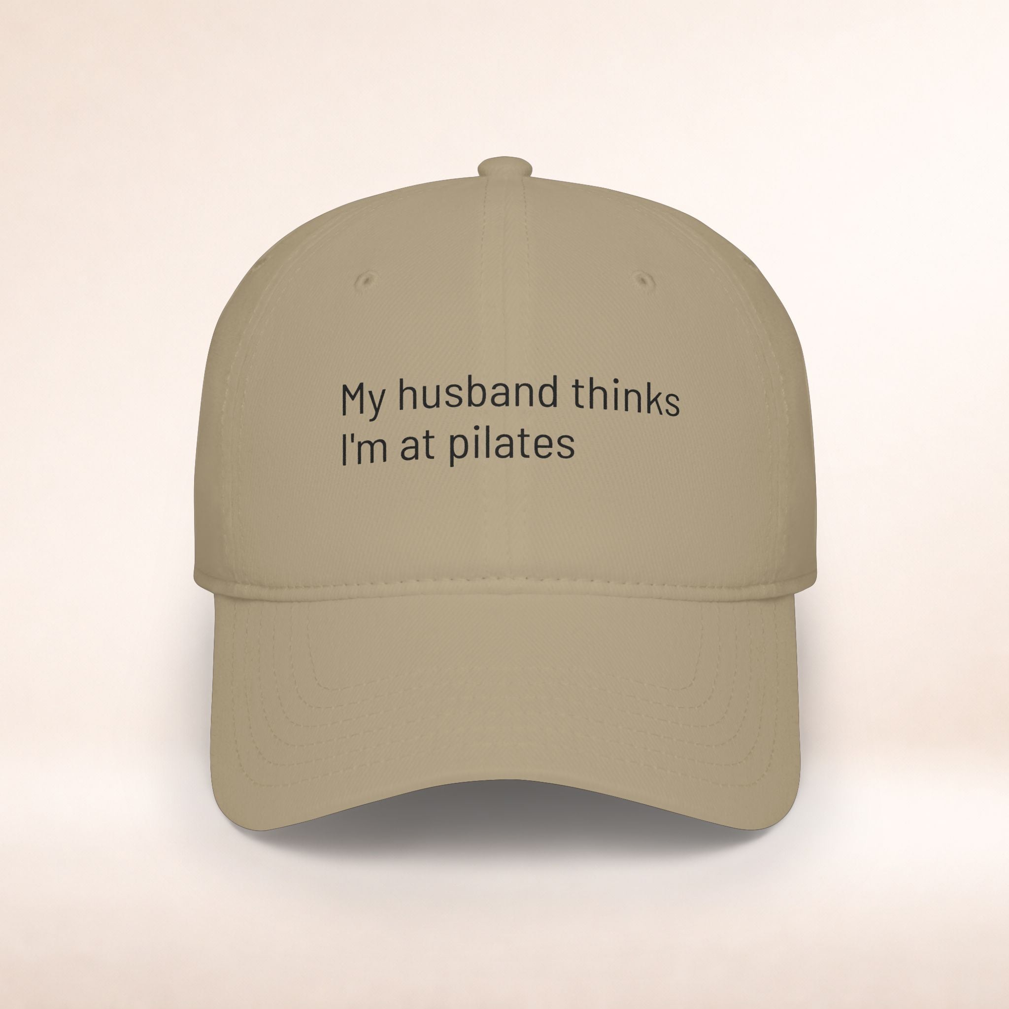 Premium embroidered "My Husband Thinks I'm At Pilates" baseball cap, low profile hat with humorous design by Printify.
