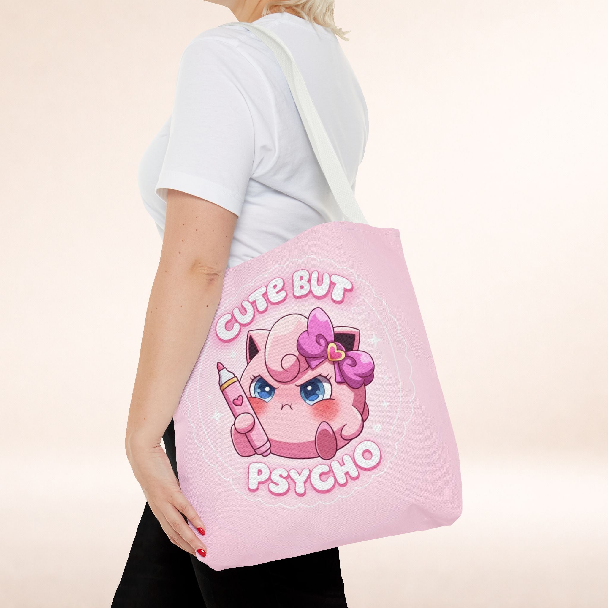 Pink "Cute But Psycho" tote bag by Printify featuring kawaii style and bold lettering, ideal for casual shopping and daily use.
