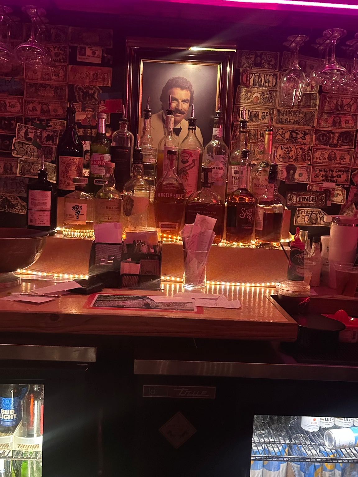 Vintage framed canvas print of a retro man cave bar portrait featuring a man with a wooden frame, ideal for man cave decor.