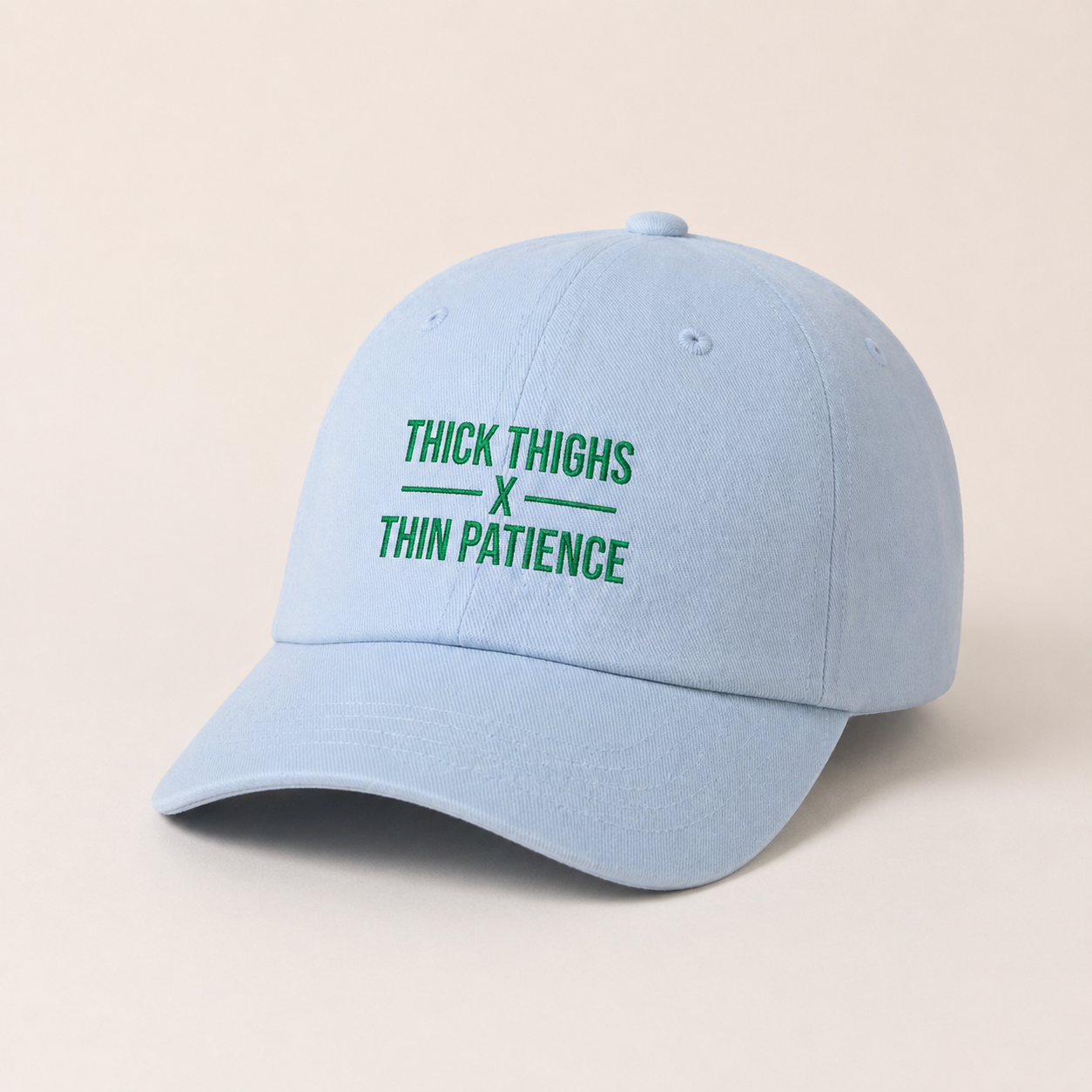 Cotton adjustable dad hat with embroidered "Thick Thighs x Thin Patience" design, featuring a classic six-panel style and curved brim.