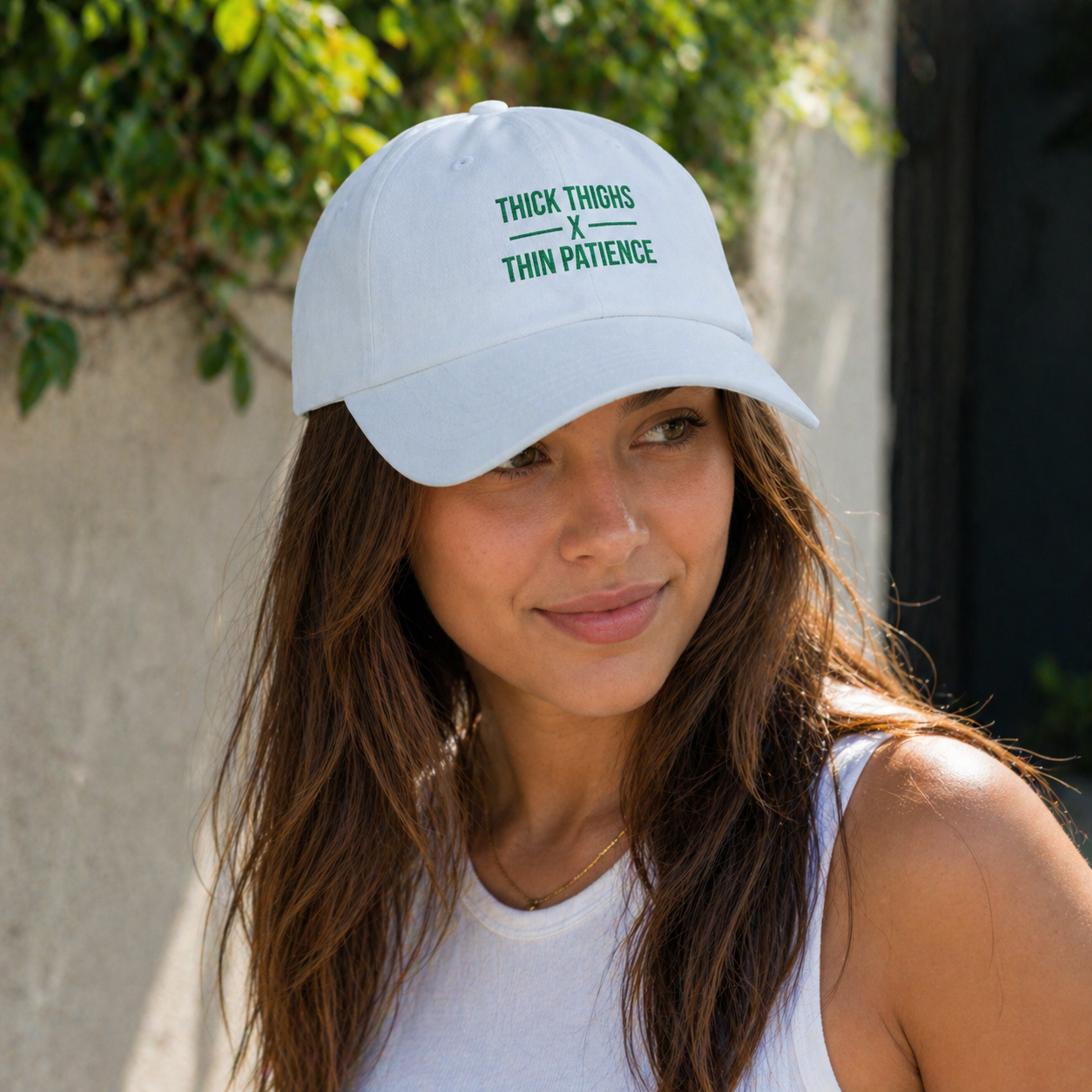 Cotton adjustable dad hat with embroidered "Thick Thighs x Thin Patience" slogan, stylish and comfortable headwear.