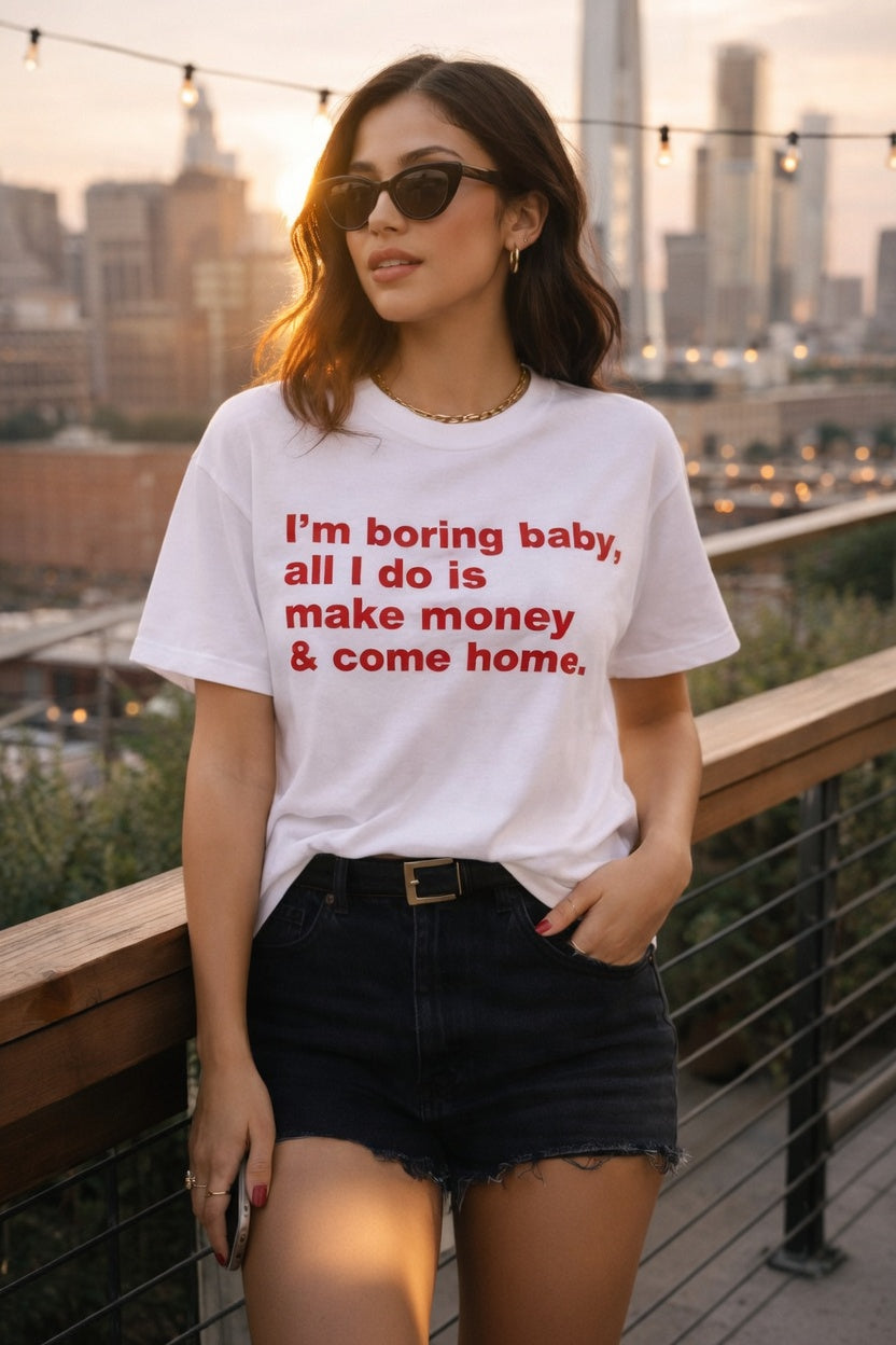 Unisex cotton T-shirt with humorous "I'm Boring Baby All I Do Is Make Money & Come Home" print, casual fit, from Printify.