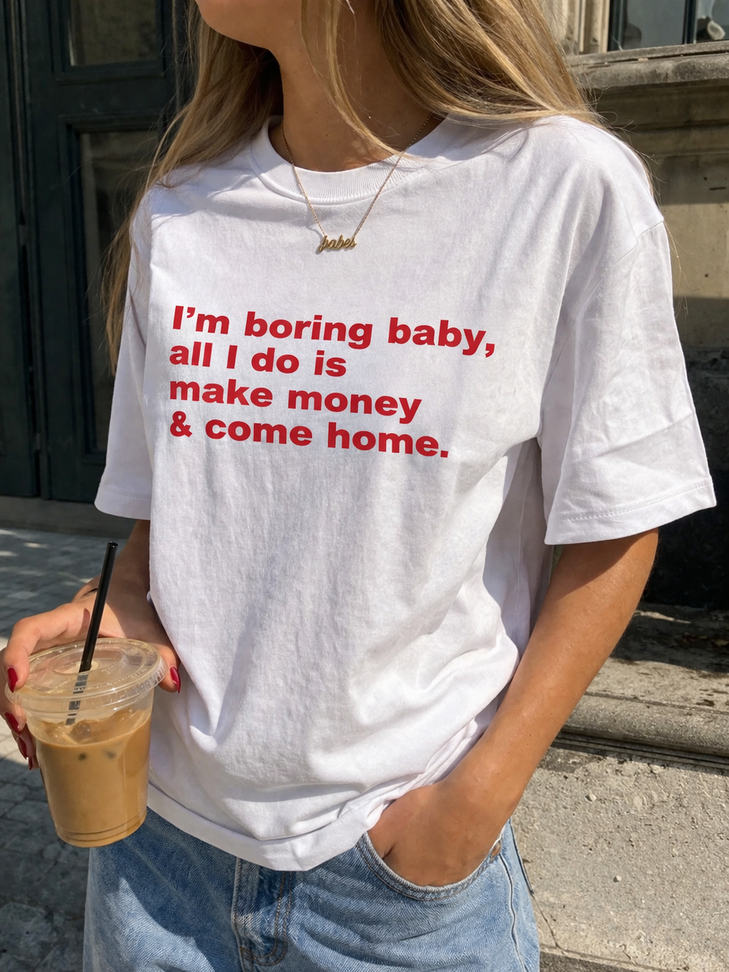 Unisex cotton T-shirt with humorous "I'm Boring Baby All I Do Is Make Money & Come Home" print, casual streetwear style.
