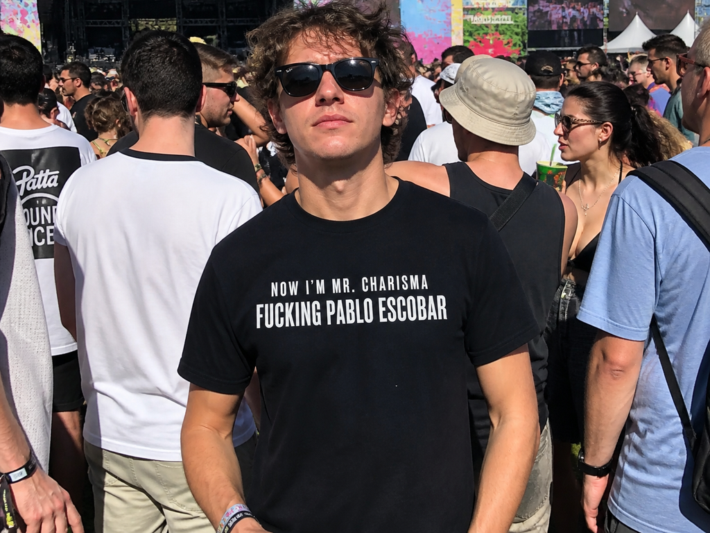 Black cotton T-shirt with bold "Now I'm Mr. Charisma Fucking Pablo Escobar" print, featuring Dracula lyrics design.