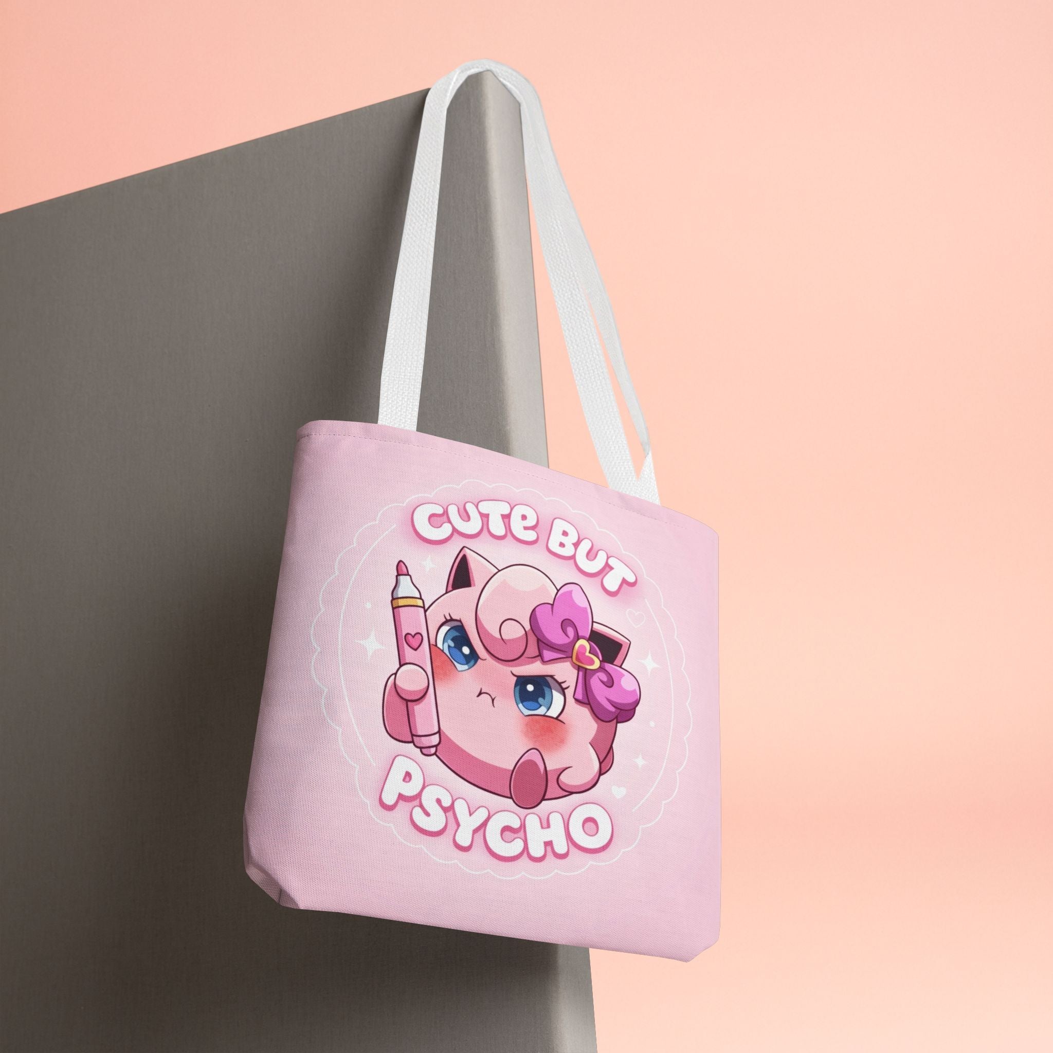 Pink "Cute But Psycho" tote bag by Printify, kawaii style, featuring bold black text and a spacious fabric shopper design.