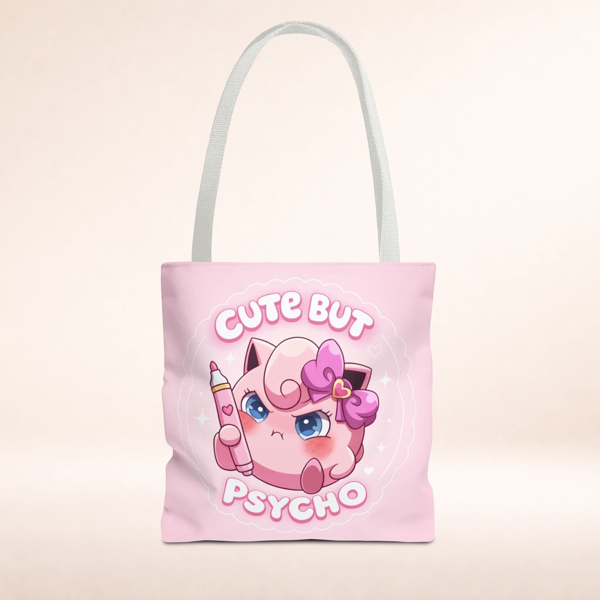Pink "Cute But Psycho" tote bag from Printify featuring kawaii style and bold text, perfect for casual shopping and everyday use.