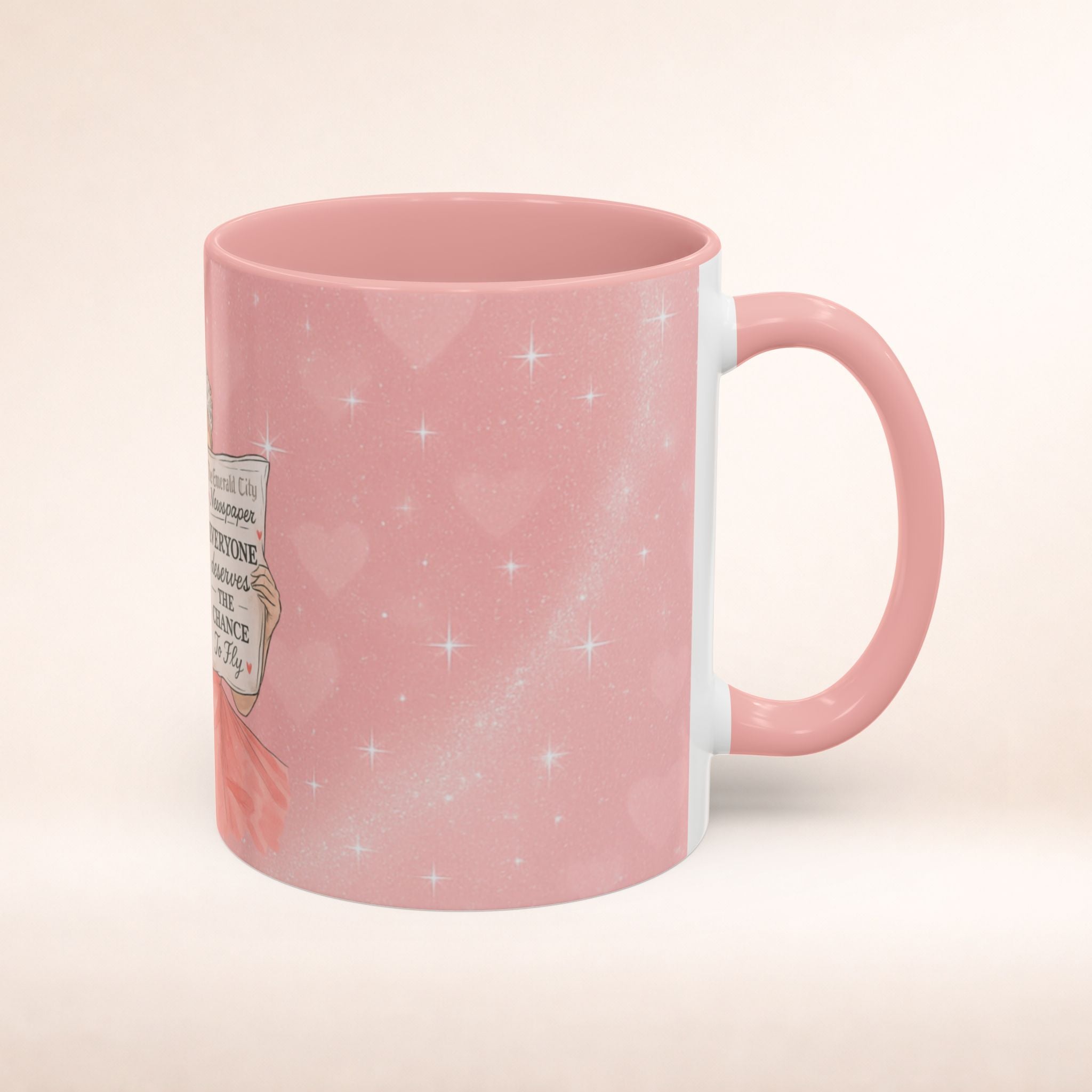 Pink ceramic coffee mug with "Everyone Deserves to Fly" message for music fans, featuring musical note designs.