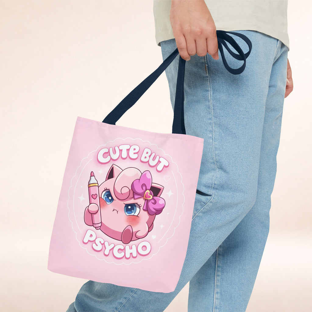 Pink "Cute But Psycho" tote bag from Printify featuring kawaii style and bold black text, perfect for casual shopping and accessories.