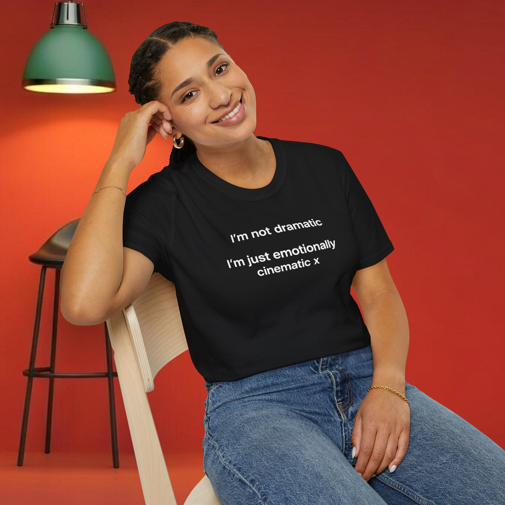 Black T-shirt with "I'm Not Dramatic, I'm Just Emotionally Cinematic" printed in white text, casual fit, from Printify.