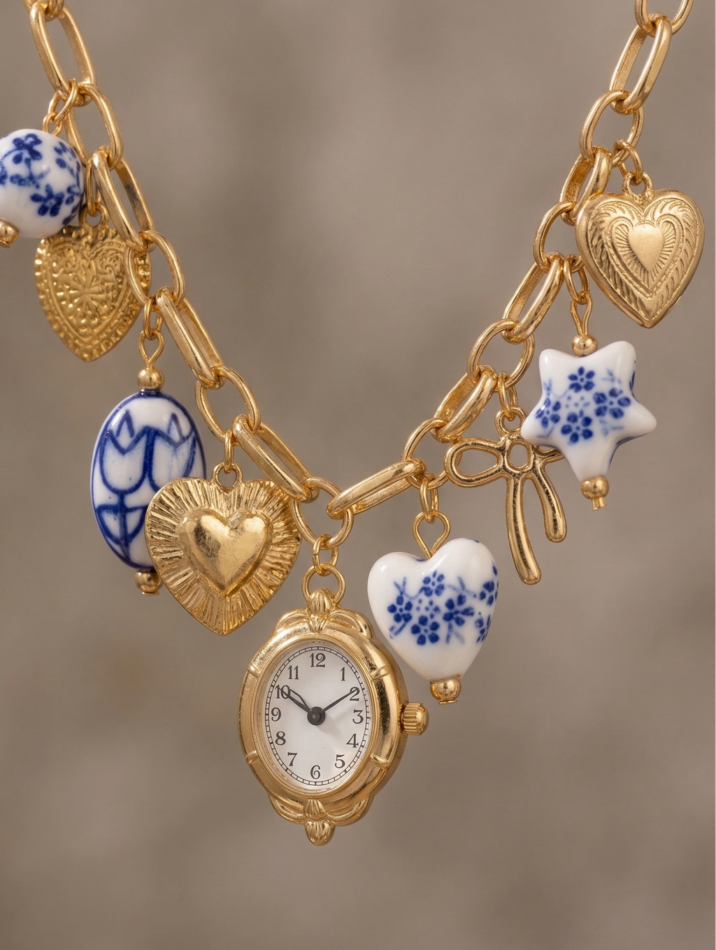 Blue ceramic faux watch charm necklace from CloudRaspberry Studio with gold porcelain accents, part of a matching jewelry set.