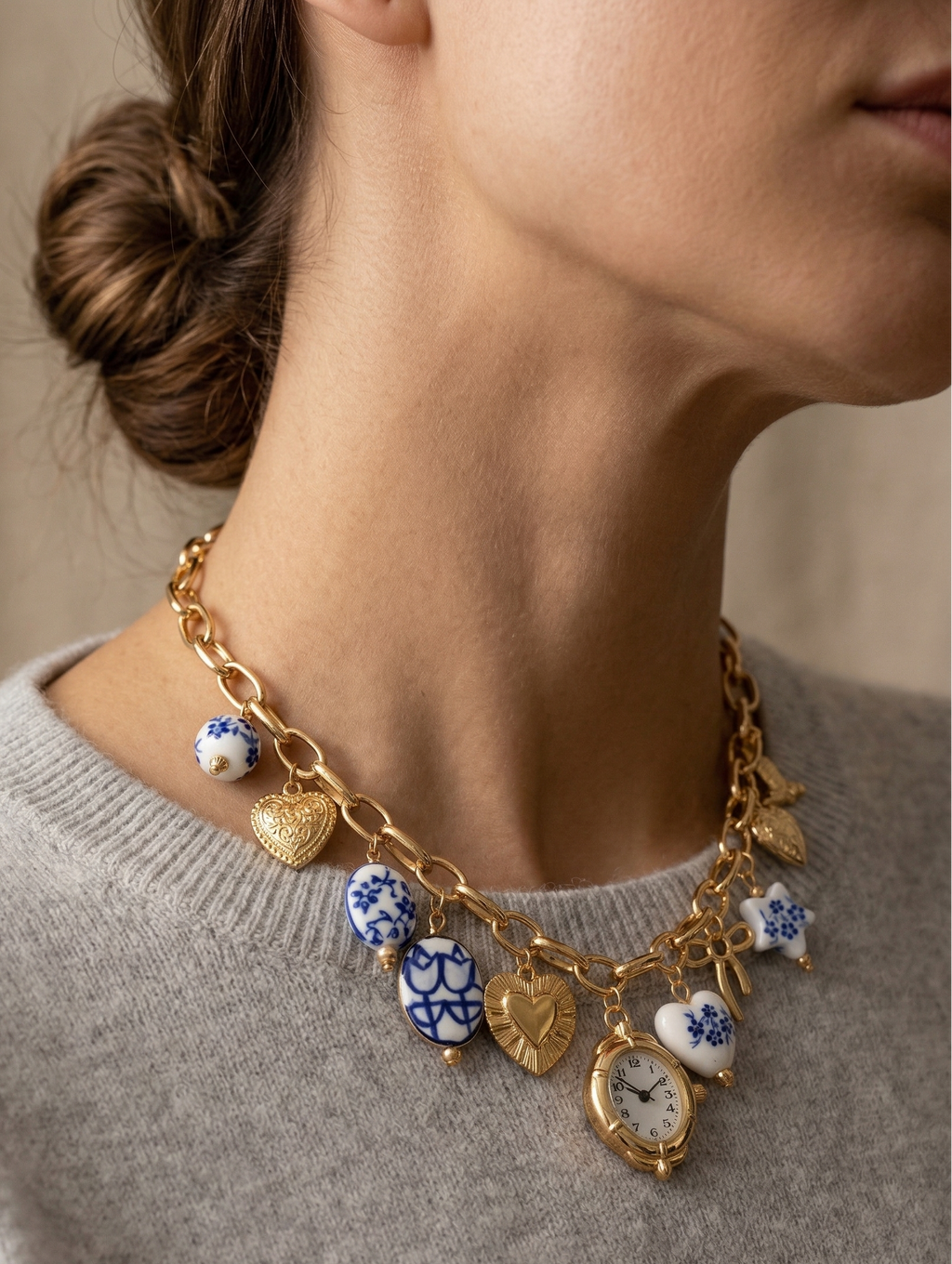 Blue ceramic faux watch charm necklace by CloudRaspberry Studio featuring gold porcelain accents, styled with a matching bracelet.