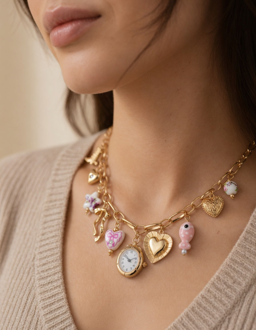 Pink ceramic watch charm necklace and bracelet set with gold floral, fish, and bow accents from CloudRaspberry Studio.