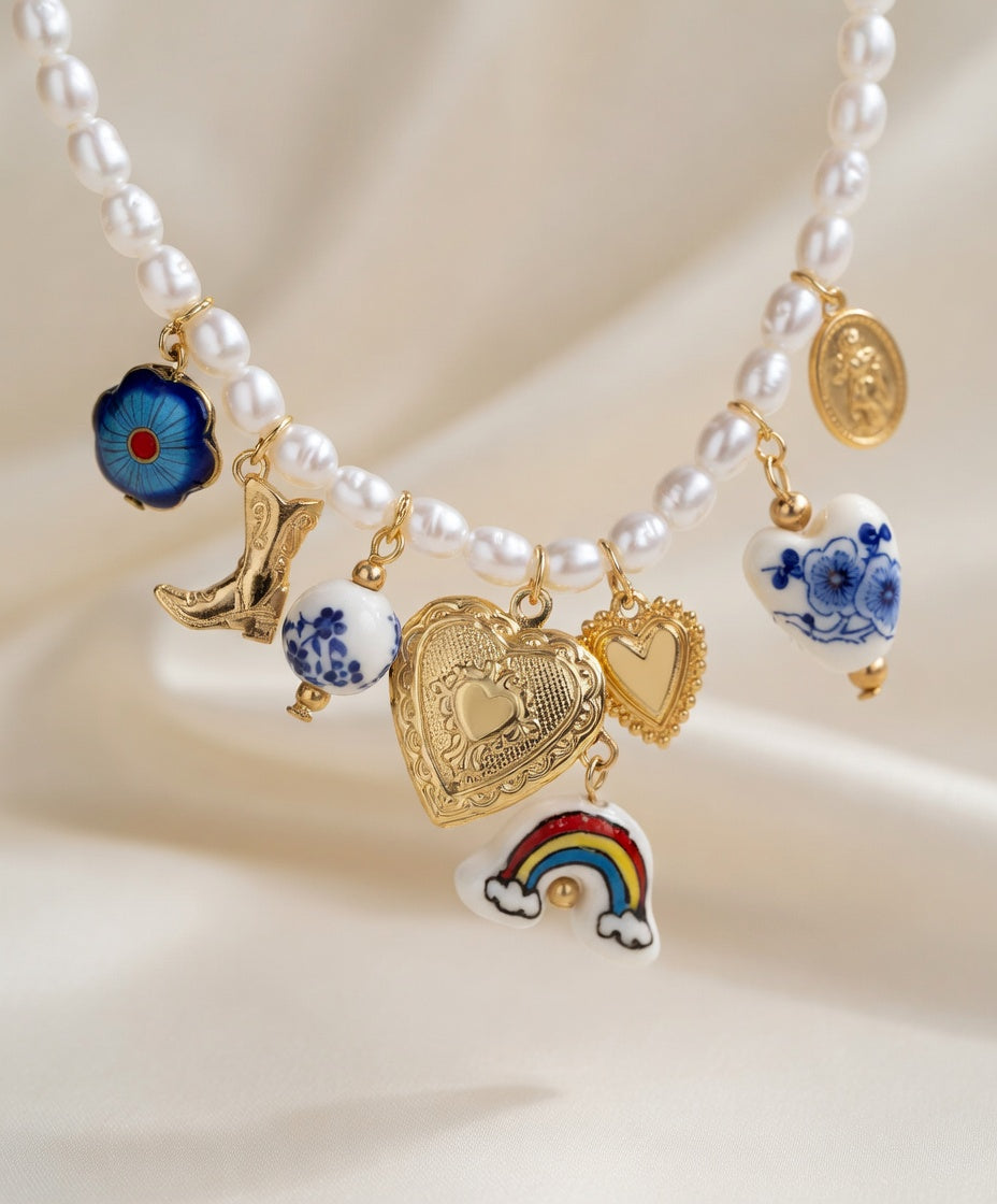 Blue floral boho pearl and ceramic charm necklace and bracelet set by CloudRaspberry Studio with cowboy charms, styled on a model.